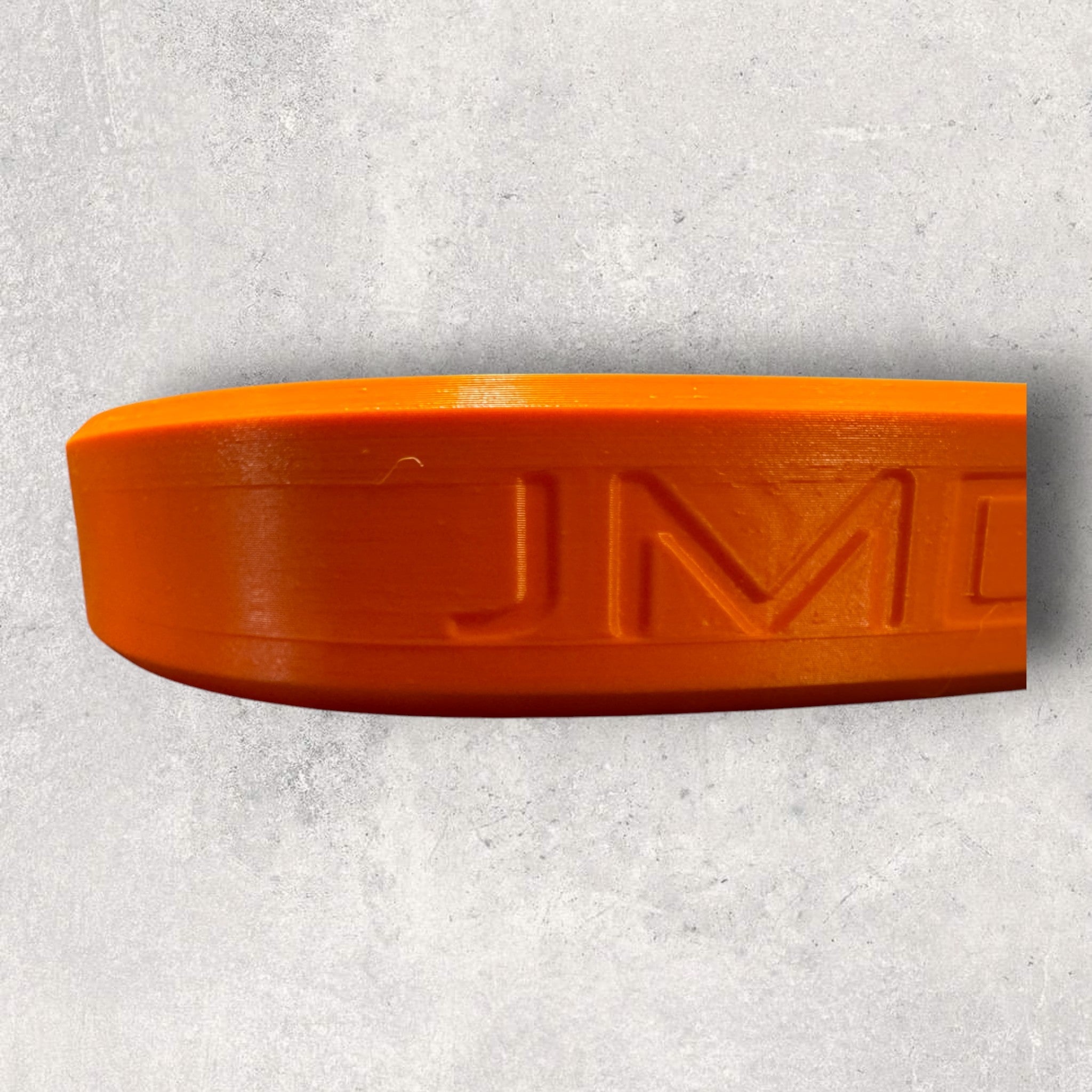 3D-printet orange beskyttelseskappe til små værktøjer - synlig gripbeskyttelse fra JM Dimensions