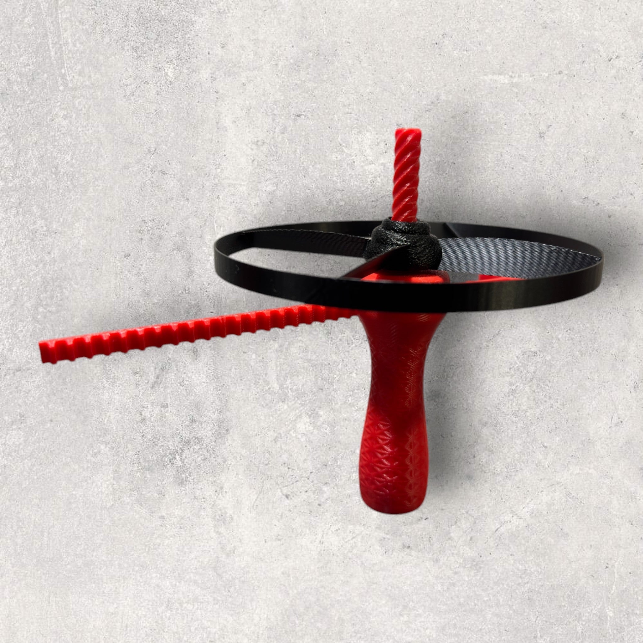 Flyvende Propel Affyrer - snor-drevet ringdisc launcher der spinner og affyrer en ringskive ved snortræk fra JM Dimensions